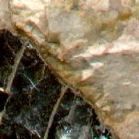 Pegmatitic texture and felsic composition